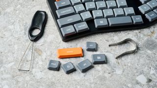 A Keychron K11 Max wireless ergonomic keyboard with a 65% Alice layout