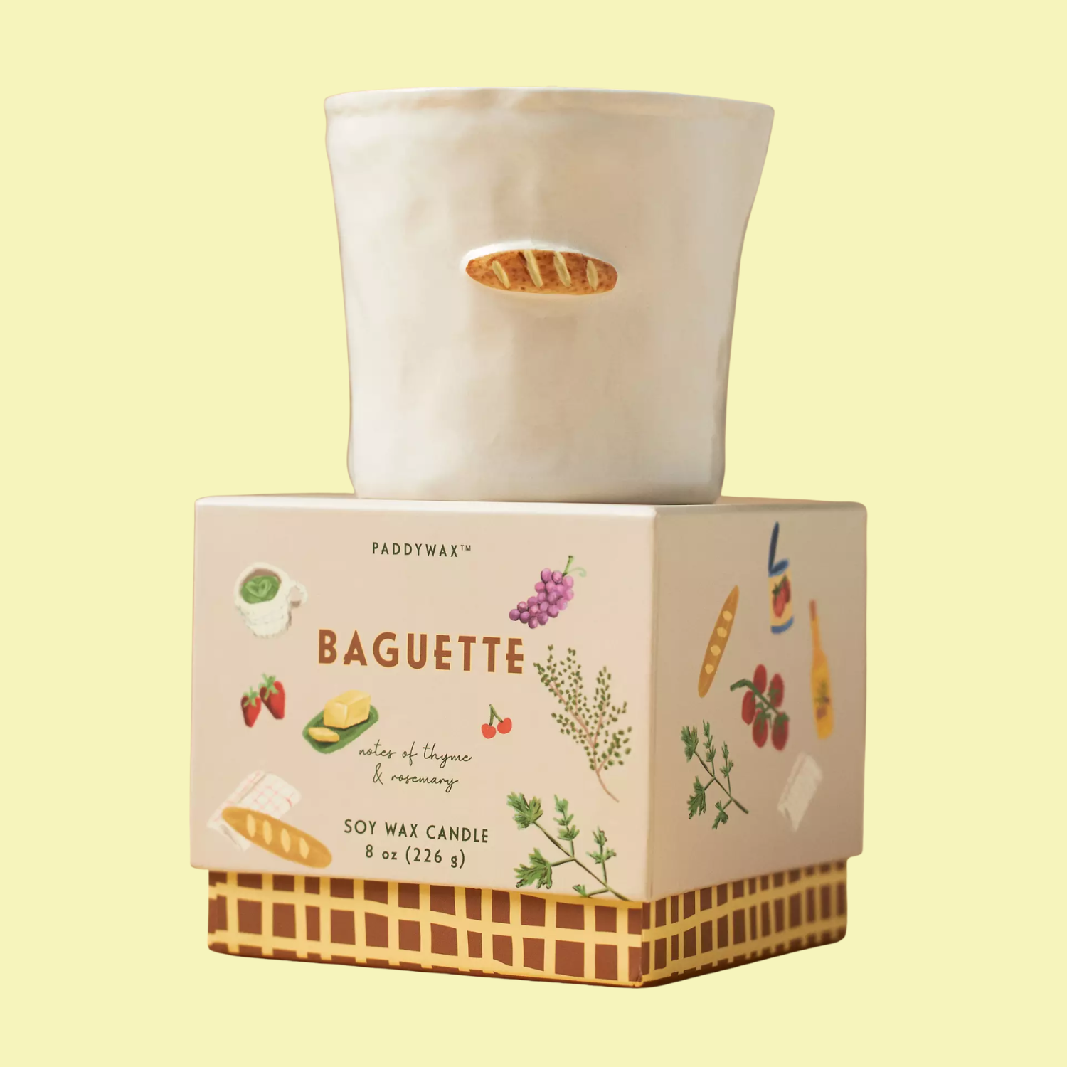 A scented ceramic candle on a box