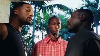 Mike and Marcus (Will Smith and Martin Lawrence) intimidate Reggie at the fornt door