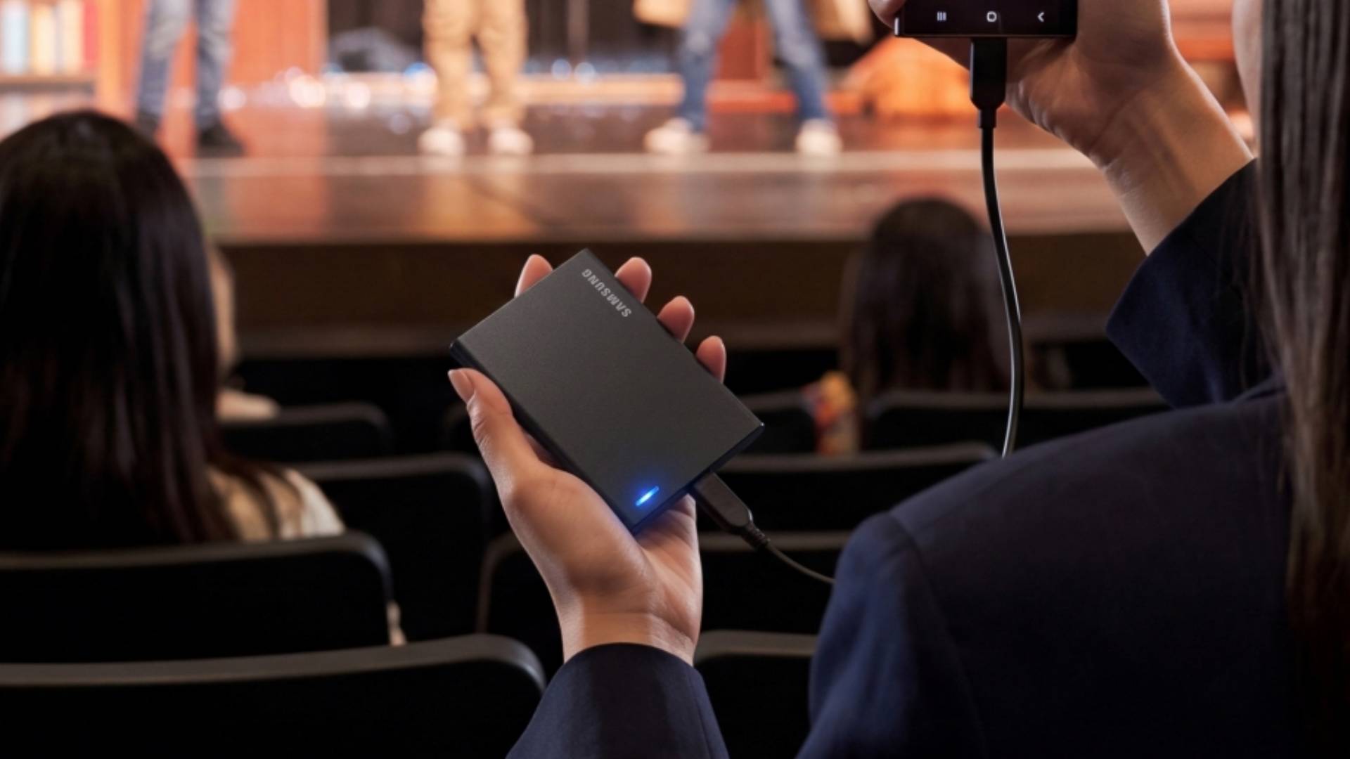 Official marketing image showing someone holding one of the new Samsung P Series SSDs.