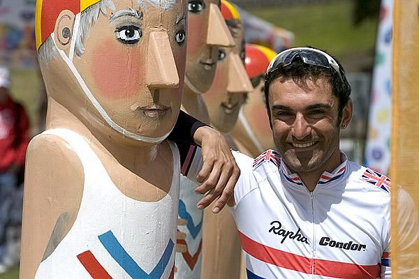 On the beach: Reigning British road champion Kristian House (Rapha Condor) loves the Aussie summer and took some time out get to know some of the local life-savers in Geelong.