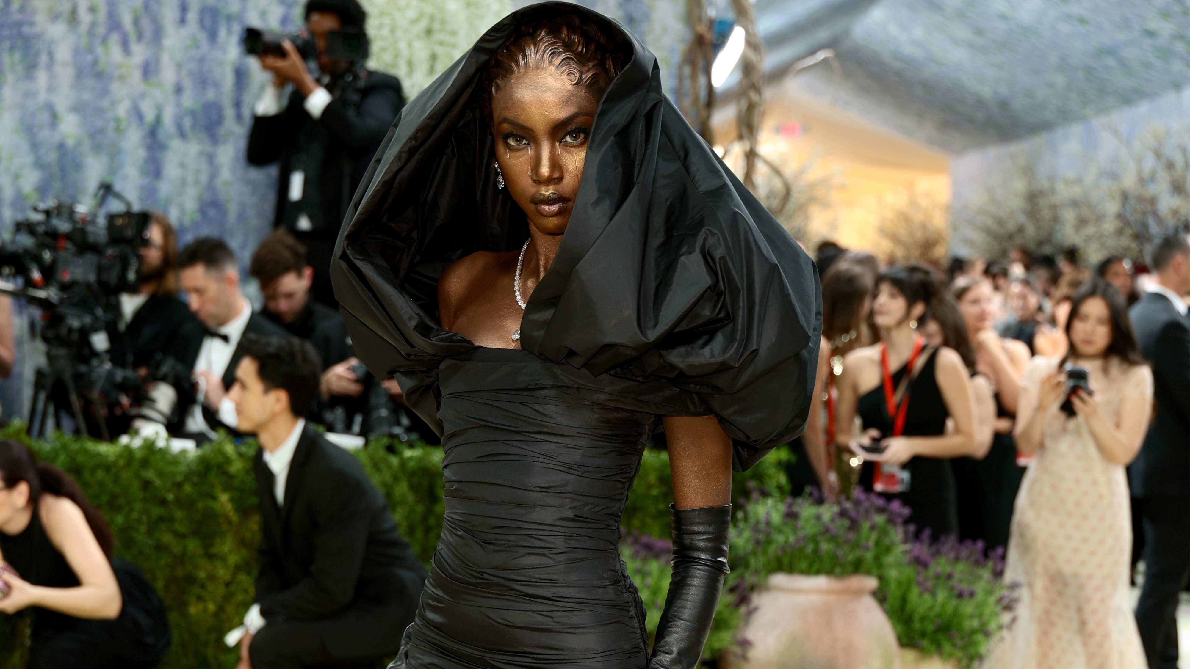anok yai attending the met gala wearing robert kun