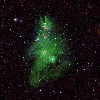 a gaseous green nebula in the shape of a christmas tree
