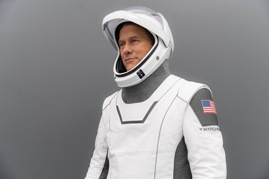 Crew-3 pilot Tom Marshburn poses for a portrait in his SpaceX-issued launch suit.