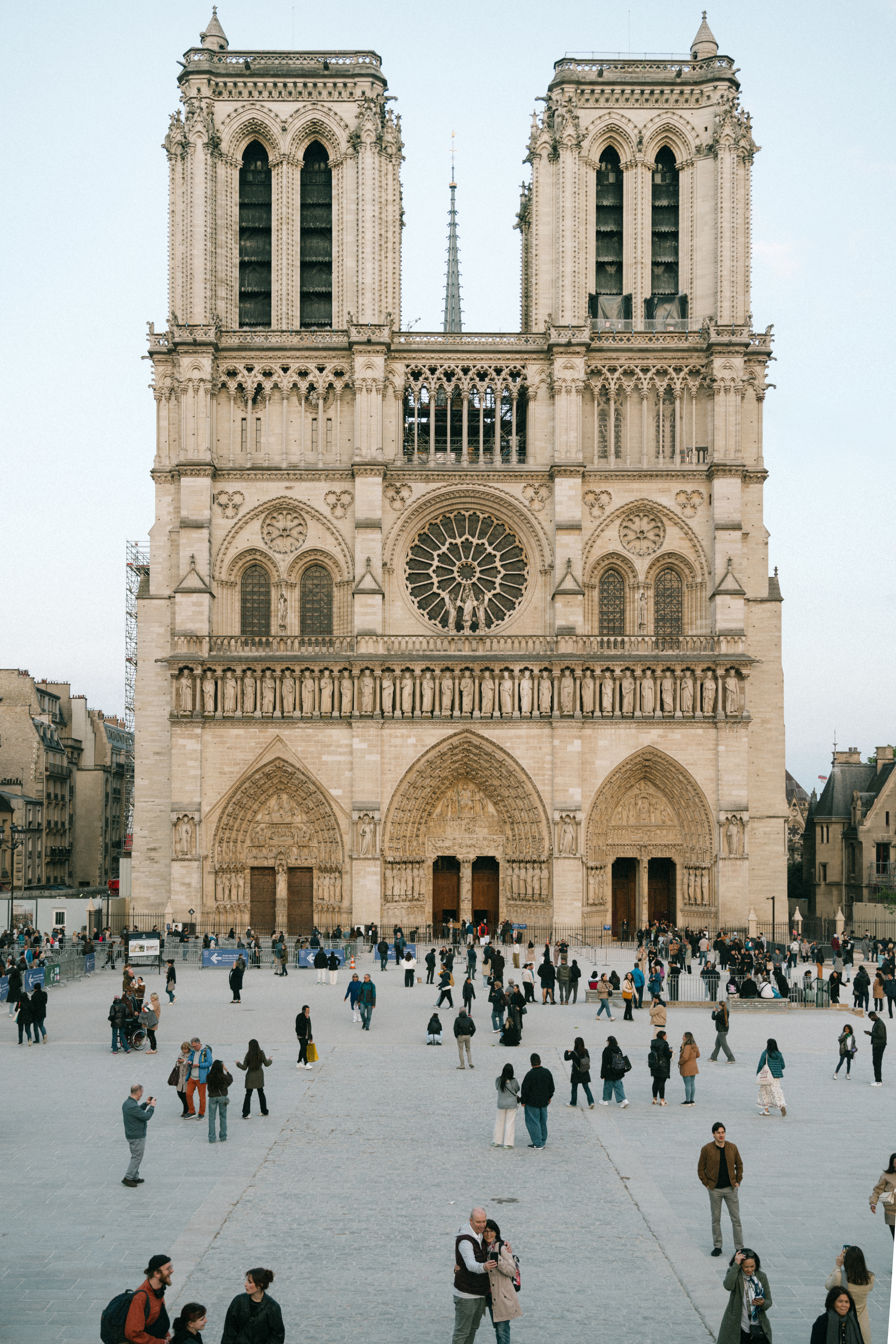Notre-Dame Cathedral in Paris with Tourists in the Foreground
