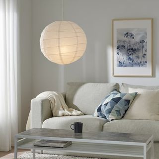 IKEA REGOLIT pendant lampshade hung in neutral living room