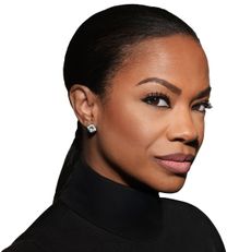 kandi burruss wearing a black turtle neck in a profile side shot
