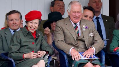 Princess Anne and King Charles laugh as they attend the Braemar Highland Gathering at The Princess Royal and Duke of Fife Memorial Park on September 3, 2022 in Braemar