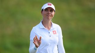 Morgane Metraux waves to the crowd at the Olympics