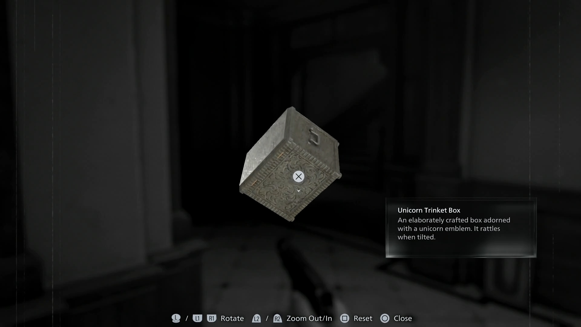 Resident Evil Requiem examining the unicorn trinket box to discover a symbol on the back