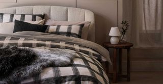 cosy boucle bed with monochrome checked bedding