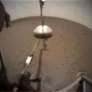 NASA's InSight Mars lander deployed its Wind and Thermal Shield on Feb. 2, 2019. The shield covers InSight's seismometer, which the lander set down on the Martian surface on Dec. 19, 2018.