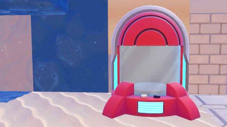 A bright red Pokopia Portal Pod stands against a wall.