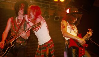 (from left) Izzy Stradlin, Axl Rose and Slash perform with Guns N' Roses at the Troubadour in Los Angeles, California on June 6, 1985
