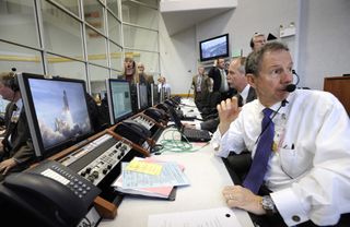 NASA Administrator Michael Griffin watches the launch of space shuttle Atlantis on mission STS-122 from the Launch Control Center at Kennedy Space Center in Florida on Feb. 7, 2008.
