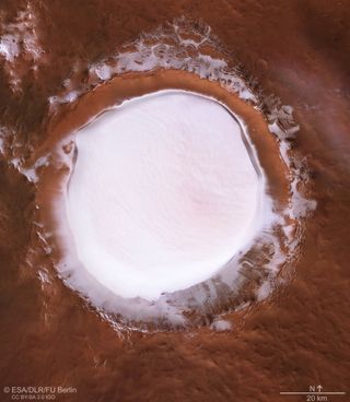 This image from ESA's Mars Express shows Korolev crater, and is composed of five observations, each one from a different orbit of the spacecraft. It's High Resolution Stereo Camera (HRSC) instrument took the data that formed the image.