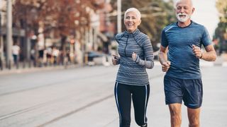 Elliptical vs running: Images shows healthy looking older couple on a run together