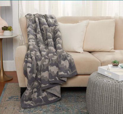 Barefoot Dreams Blanket on display on couch