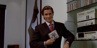 American Psycho Christian Bale as Patrick Bateman with Huey Lewis album