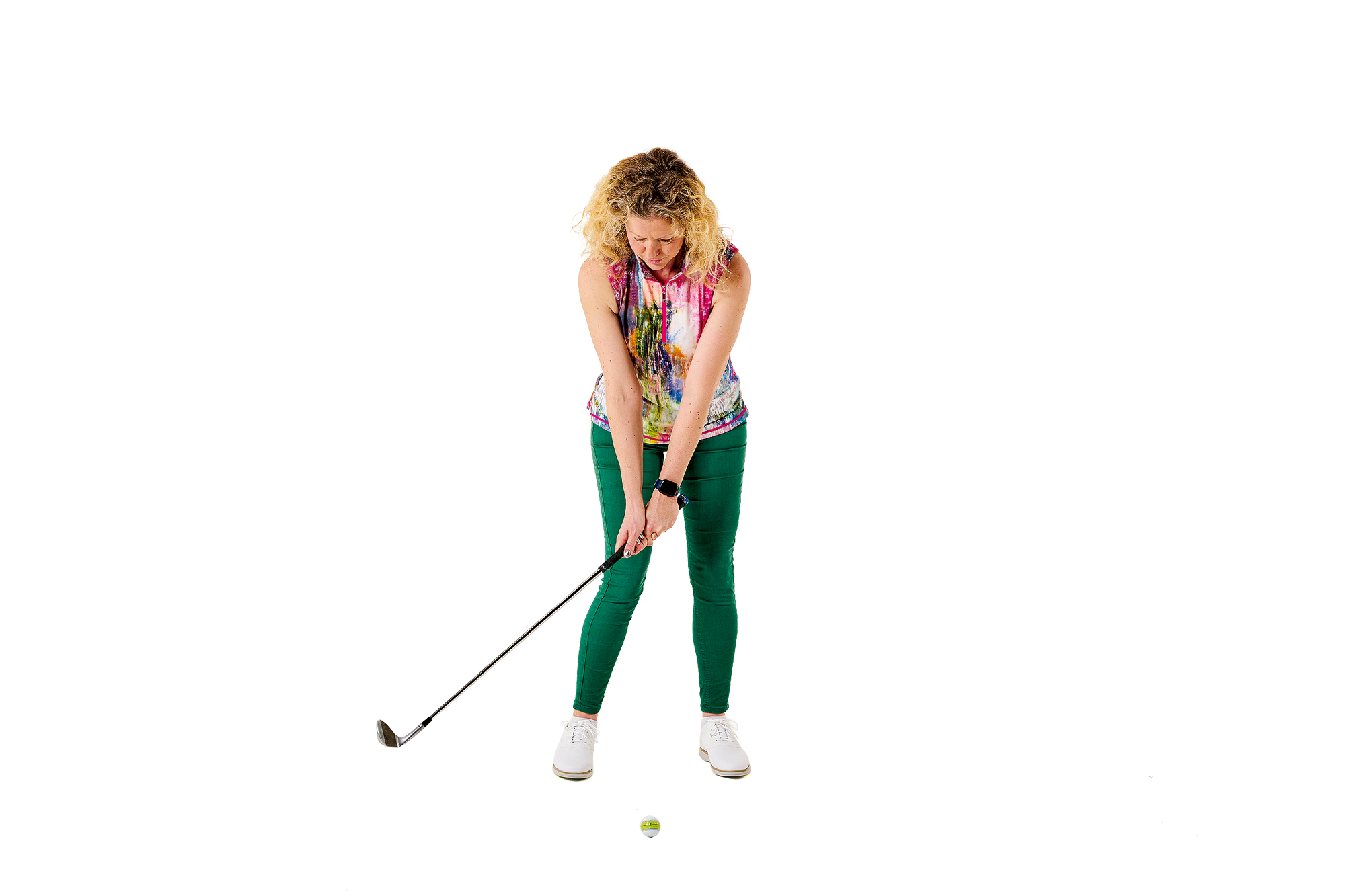 Katie Dawkins demonstrating setup for chipping, including the correct ball position and stance width.