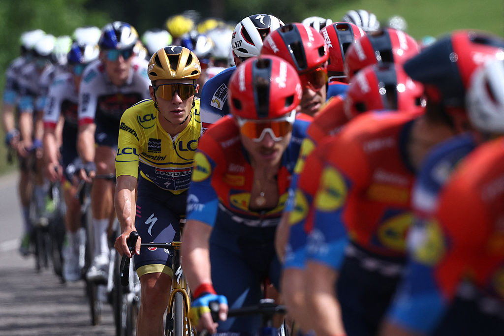 2025 Criterium du Dauphine stage 5: Remco Evenepoel in the yellow jersey in the peloton