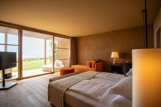 inside a room looking out to green expanses at Adler spa resort Sicily