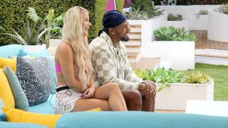 Deb and Jesse sitting on a couch in Love Island USA season 4