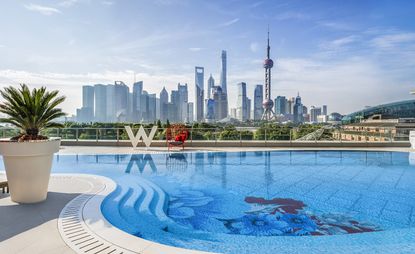 The W Hotel swimming pool overlooks the city's skyline