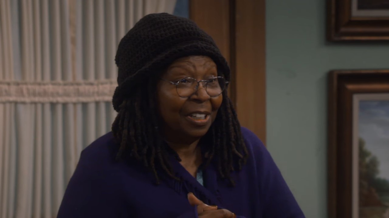 Whoopi Goldberg in purple coat on The Conners