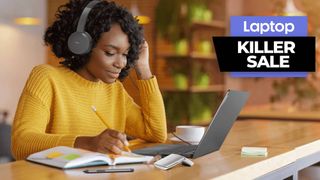 Lenovo back to school sale, woman using Lenovo laptop and headphones in library while writing in a book