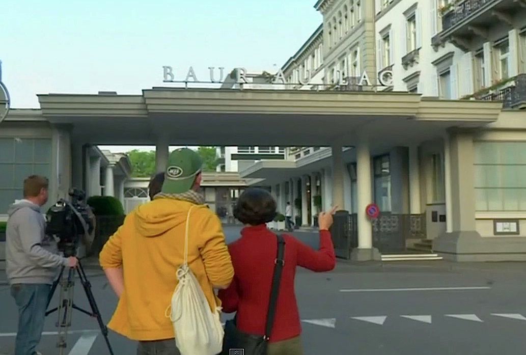 Reporters gather outside a Zurich hotel where six FIFA officials were arrested Wenesday