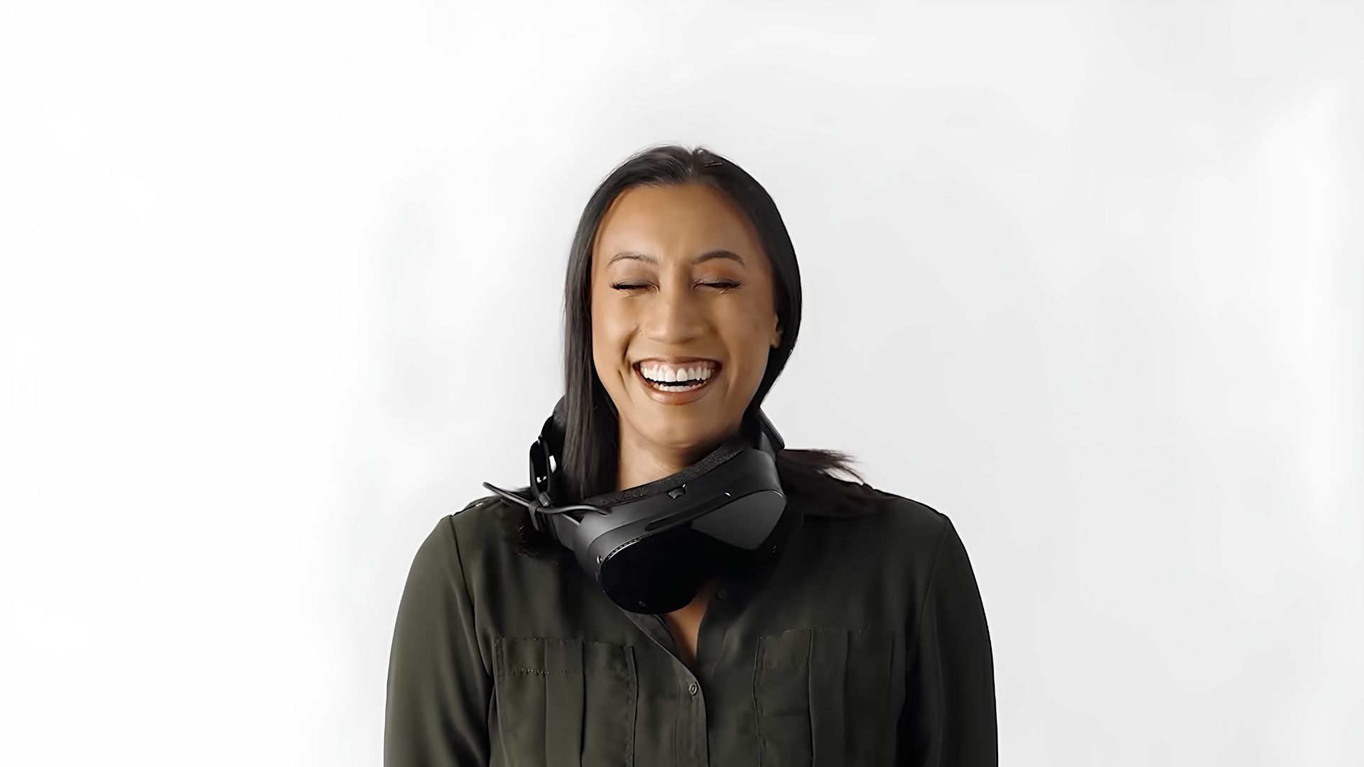 A woman laughingly wearing the Steam Frame &amp;quot;wrong&amp;quot; in one of Valve's user guide videos for the headset