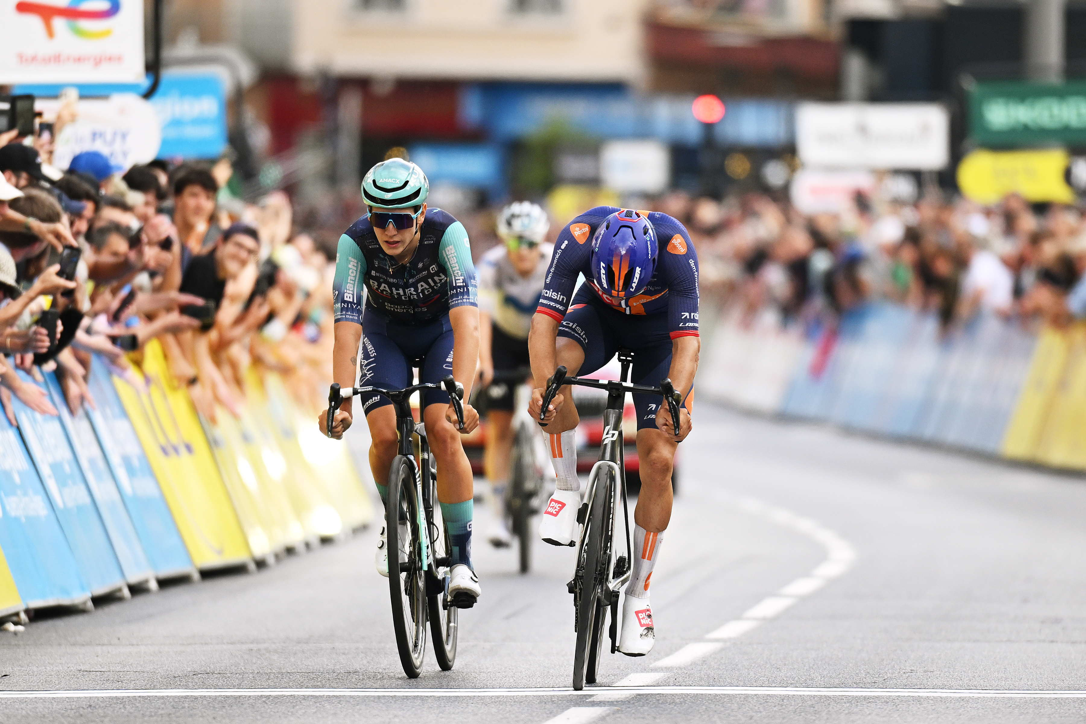 LE PUY-EN-VELAY, FRANCE - JUNE 08: (L-R) Vlad Van Mechelen of Belgium and Team Bahrain - Victorious and Henri-Francois Renard-Haquin of France and Team Picnic PostNL cross the finish line during the 78th Tour Auvergne-Rhone-Alpes 2026, Stage 2 a 234.3km stage from Saint-Martin-le-Vinoux to Le Puy-en-Velay 624m / #UCIWT / on June 08, 2026 in Le Puy-en-Velay, France. (Photo by Dario Belingheri/Getty Images)