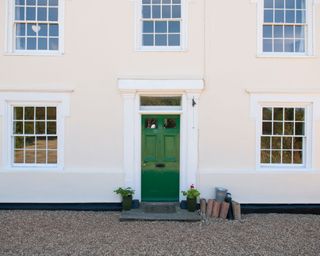 front door of home with gravel
