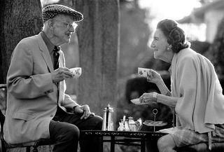 Black and white photo of Wodehouse drinking tea with his wife