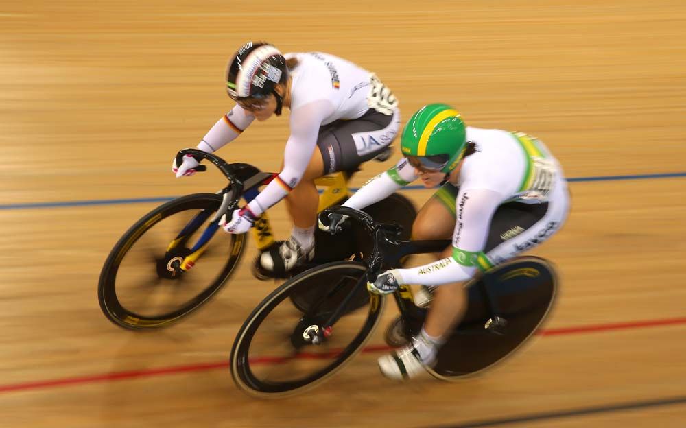 Kristina Vogel goes around Anna Meares in the sprint