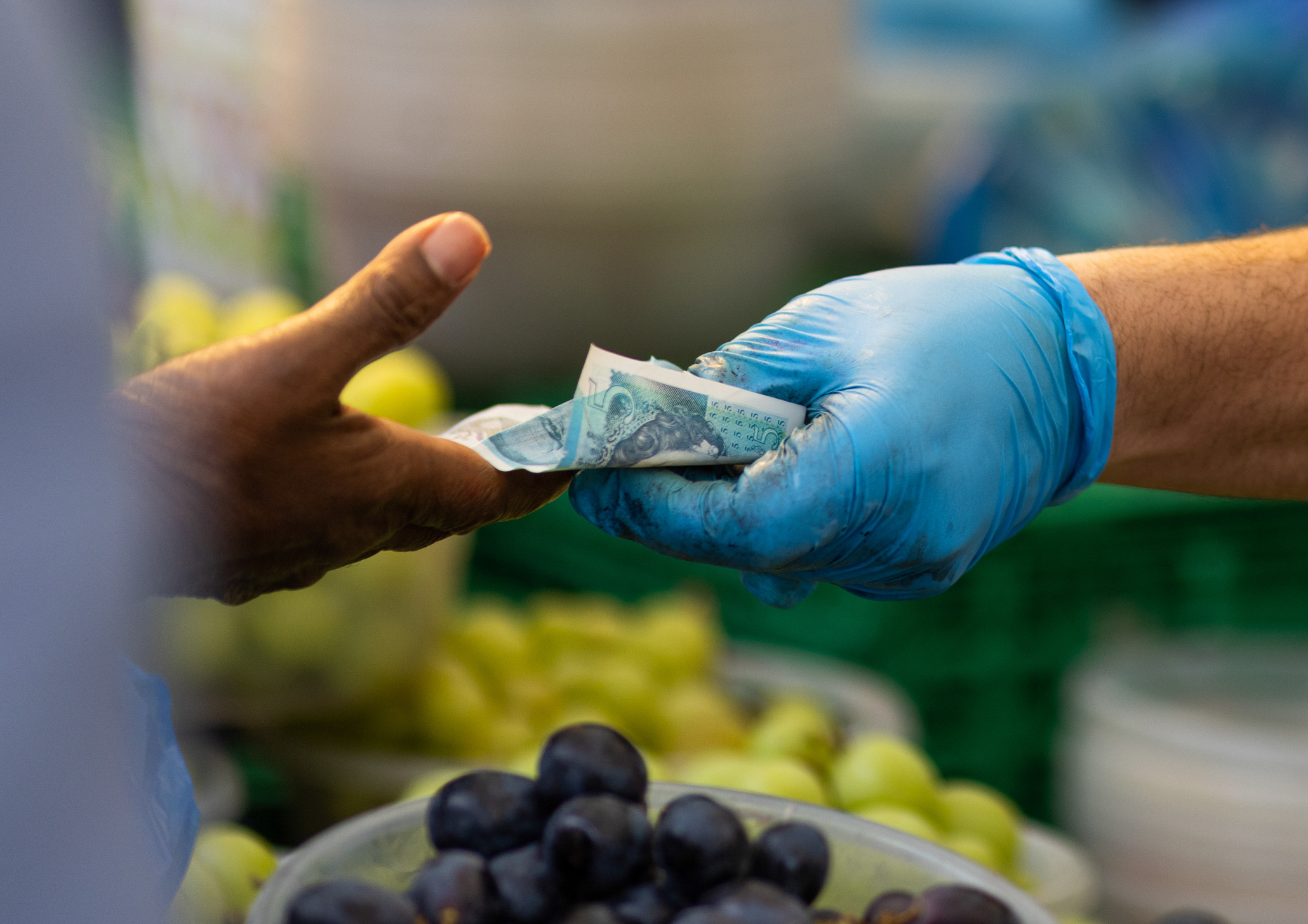 Exchanging money at a market representing inflation