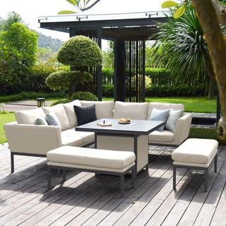 Decking area with large corner sofa set and metal table