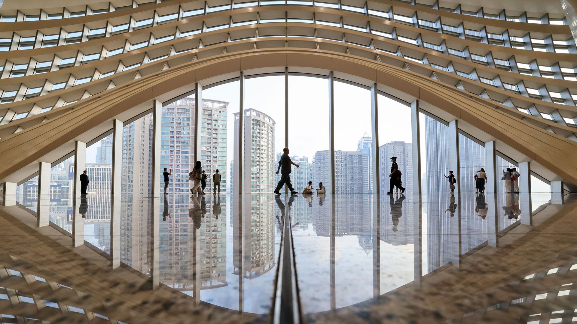 Passengers walk through the departures hall of the newly renovated Huanggang Port in Shenzhen, China