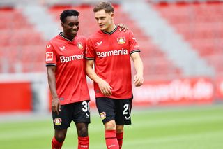 Jeremie Frimpong and Florian Wirtz of Bayer 04 Leverkusen on the way to the team presentation at BayArena on July 25, 2022 in Leverkusen, Germany.