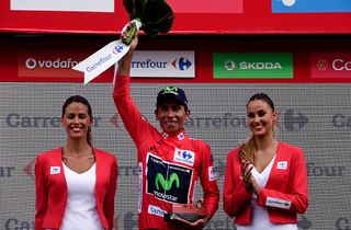 Movistar's Colombian cyclist Nairo Quintana celebrates on the podium retaining the red jersey after the 16th stage of the 71st edition of 'La Vuelta'