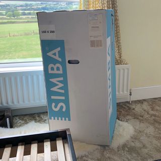 Simba Hybrid mattress in a box in a bedroom ready to be opened