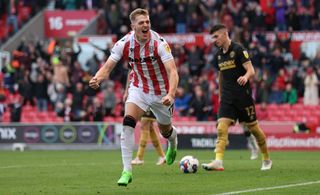 Liam Delap of Stoke City celebrates after he scores their third goal during the Sky Bet Championship between Stoke City and Sheffield United at Bet365 Stadium on October 08, 2022 in Stoke on Trent, England.