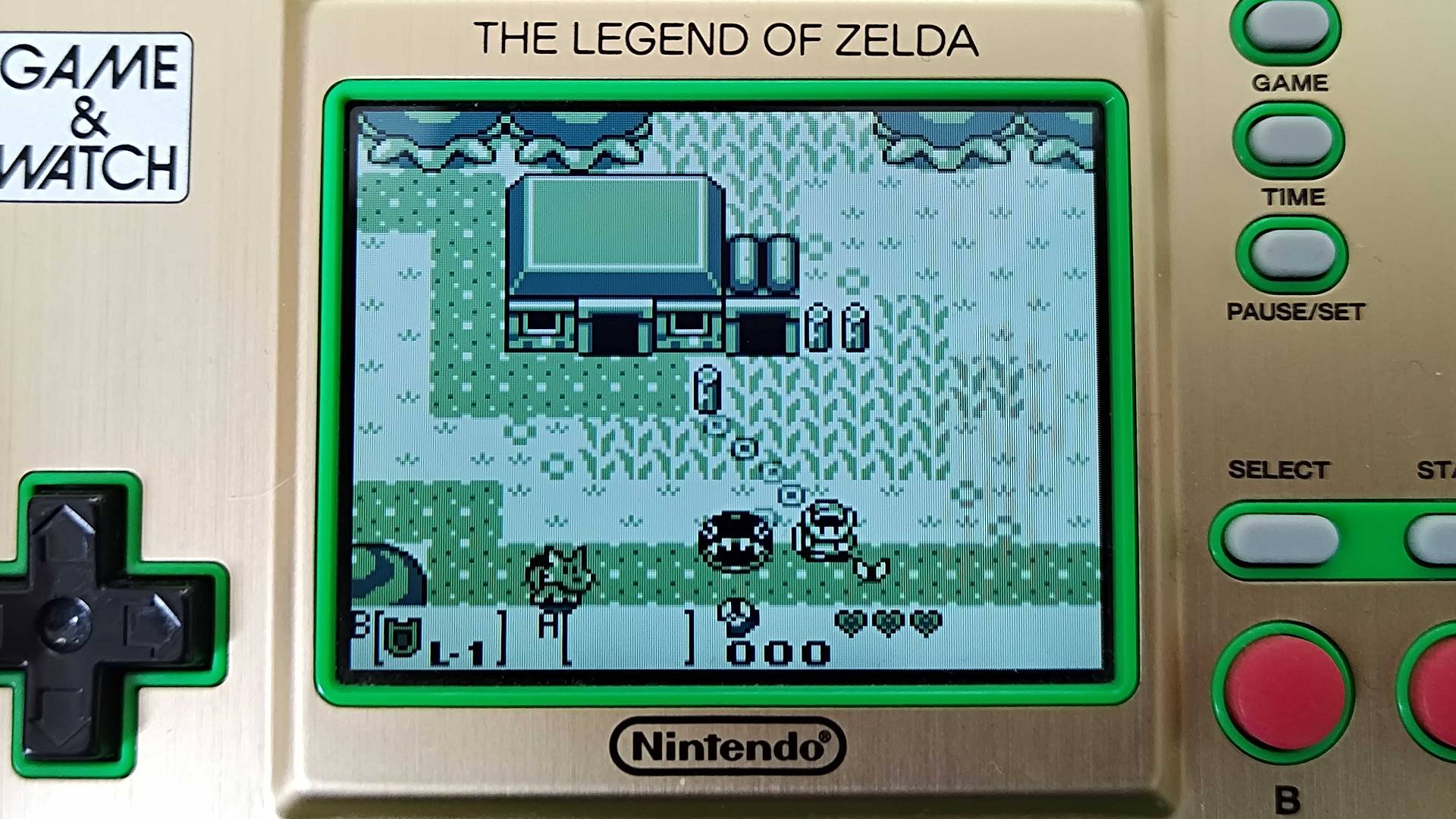 Close-up of Zelda Game &amp;amp; Watch handheld screen with Link&#039;s Awakening gameplay on screen.
