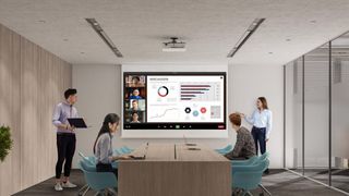 A boardroom of coworkers using the Sony 3LCD laser projector for a presentation.