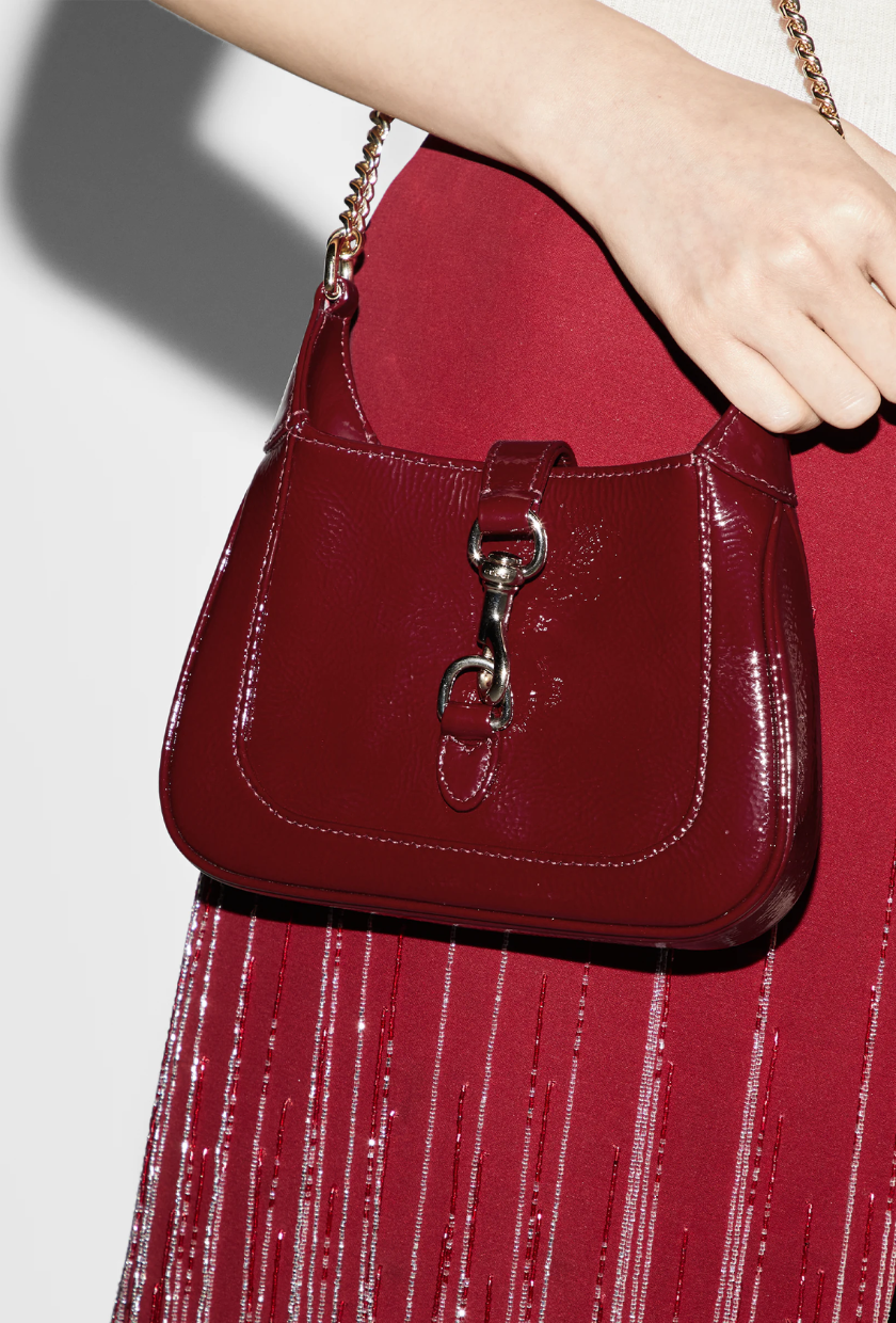 An image of the Gucci Jackie Notte Mini Bag in Rosso Ancora Patent Leather.