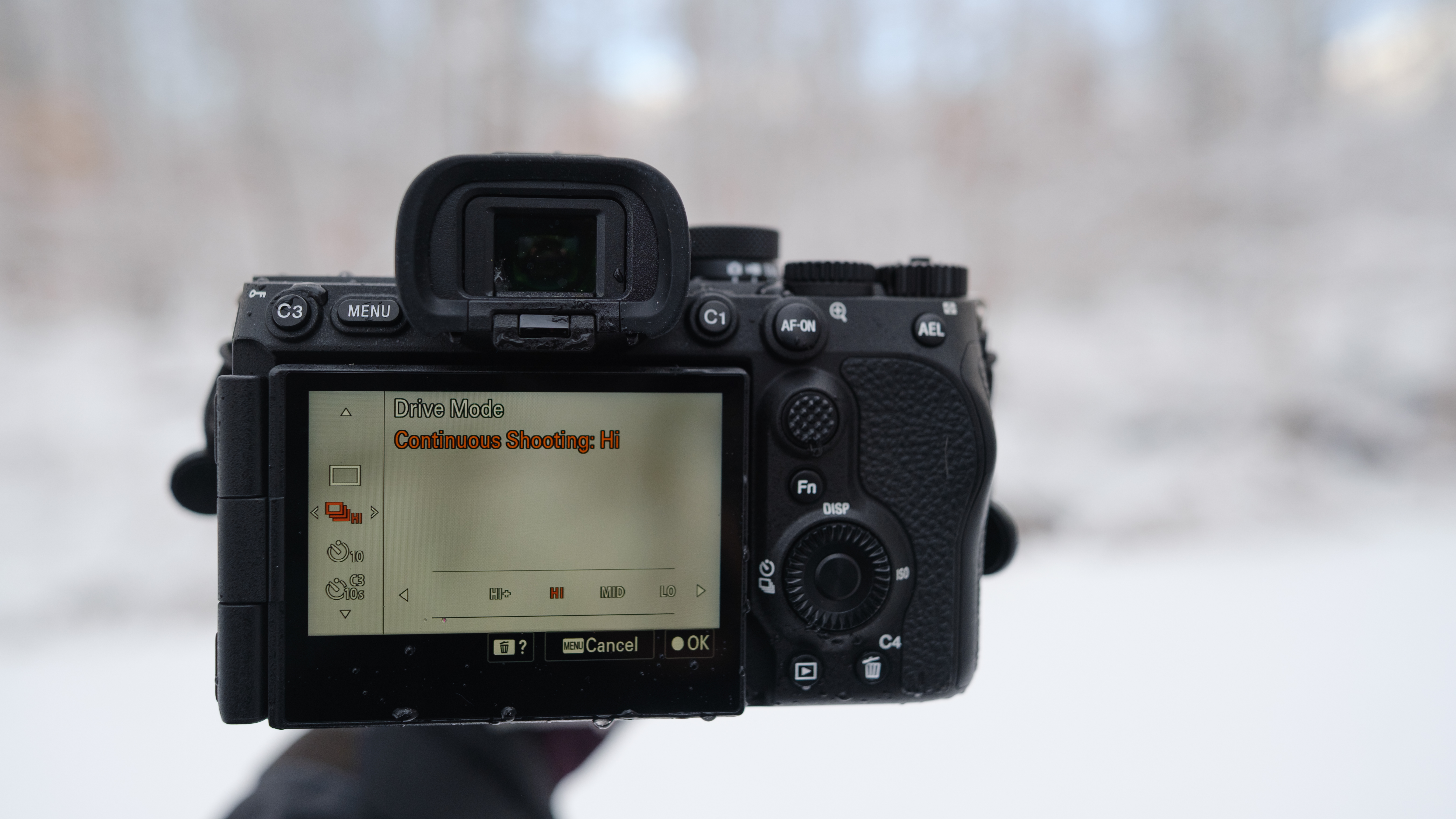 The Sony A7 V covered in snow