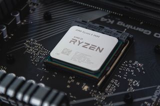 A close up of an AMD Ryzen processor in the X570 motherboard socket