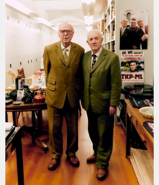 Gilbert & George in suits photographed side by side