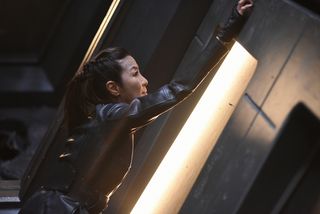 Georgiou (Michelle Yeoh) fights off Control (in the form of Leland) inside Discovery as the battle rages outside.